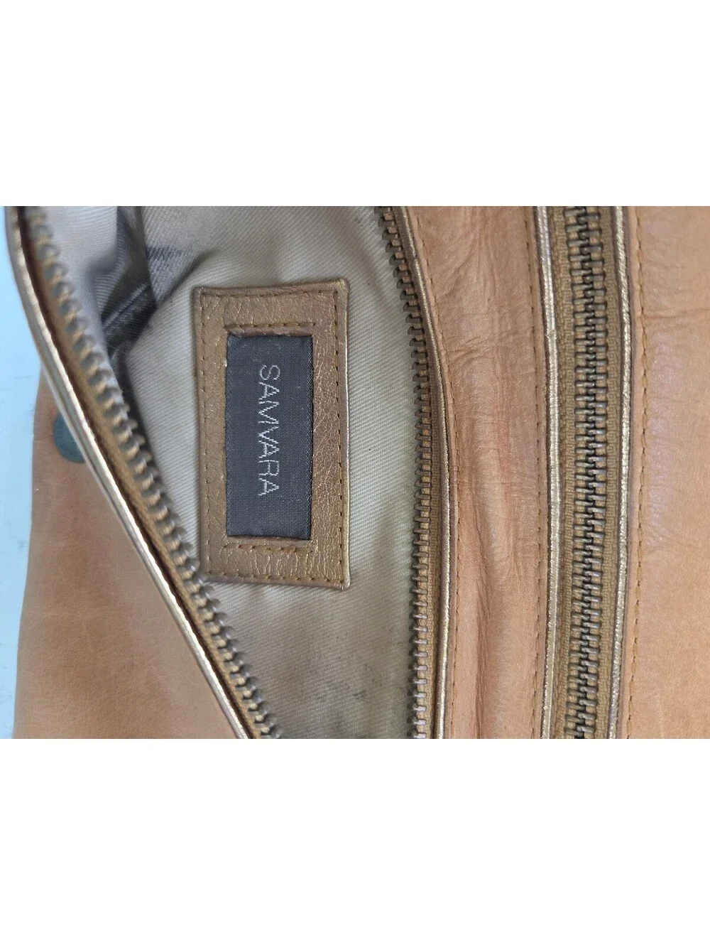Samvara Leather Wristlet Clutch with Gold Embroidered Detail